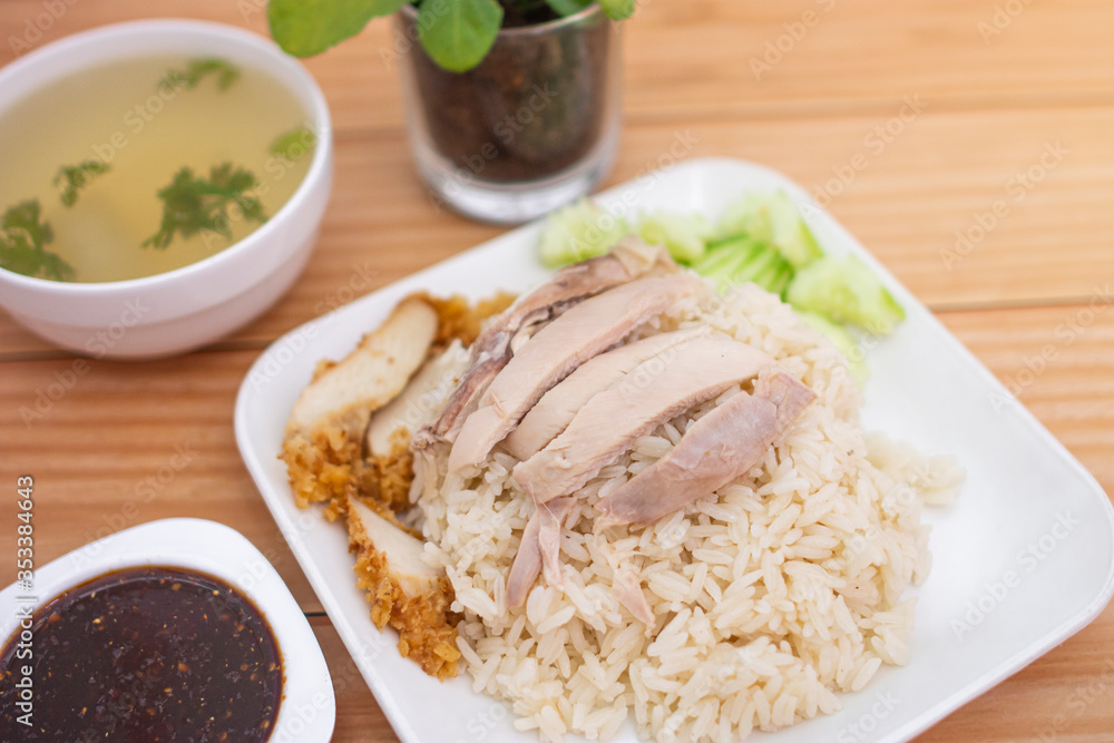 Chicken rice on the table, brown wood background. Chicken rice on the table, brown wood background.