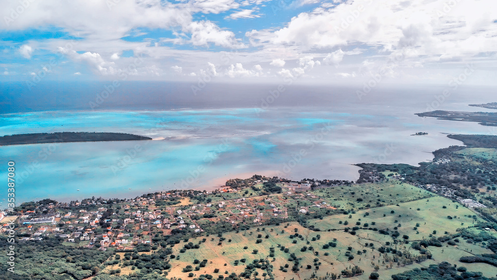 Panoramic aerial view of Mauritius coastline, Africa. Sunny day with ocean and vegetation