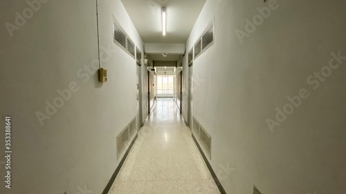Corridor to rooms in the dormitory in warmlight