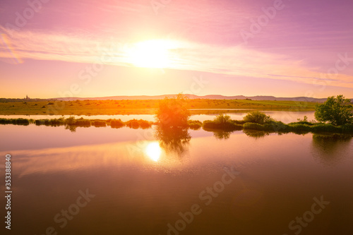 Magical sunset over the lake. Serene lake in the evening. Nature landscape.