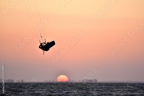 silhouette of a kitesurfer