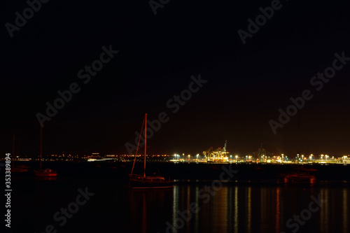 View over Auckland harbour at sea port at night