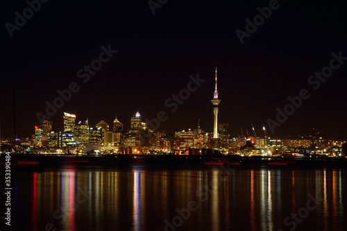 View over Auckland harbour at Auckland CBD skyline at night. © Irina B