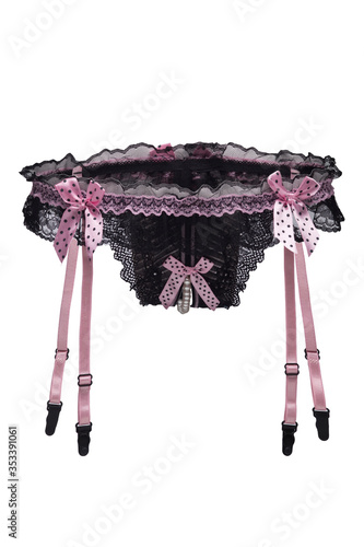 Detailed shot of black garter panties with pink straps and decorated with pink bows and a string of pearls in the intimate cutout. The delicate lace lingerie is isolated on the white background.