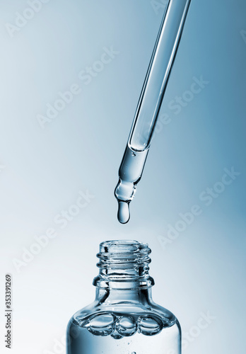 Cosmetic pipette with hyaluronic acid. Transparent gel with bubbles close-up. Gel cream or serum. A sample of a cosmetic product. Antibacterial gel.