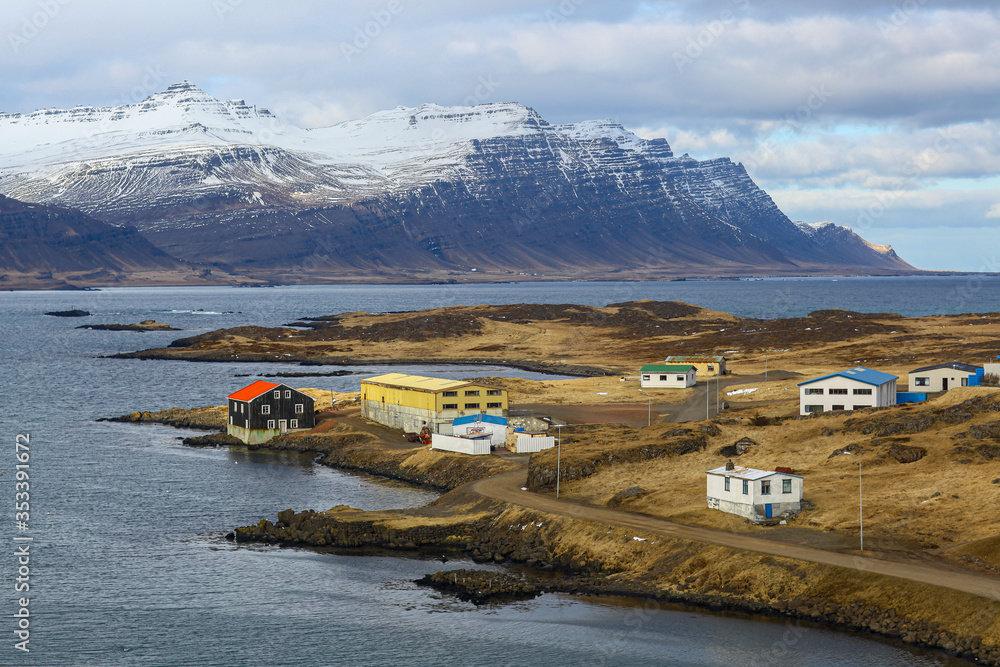 Norwegian Lodge on the shores of the Northern ocean in the background of the Bay and the mountains