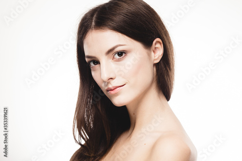 Young beautiful woman portrait with healthy skin studio on white