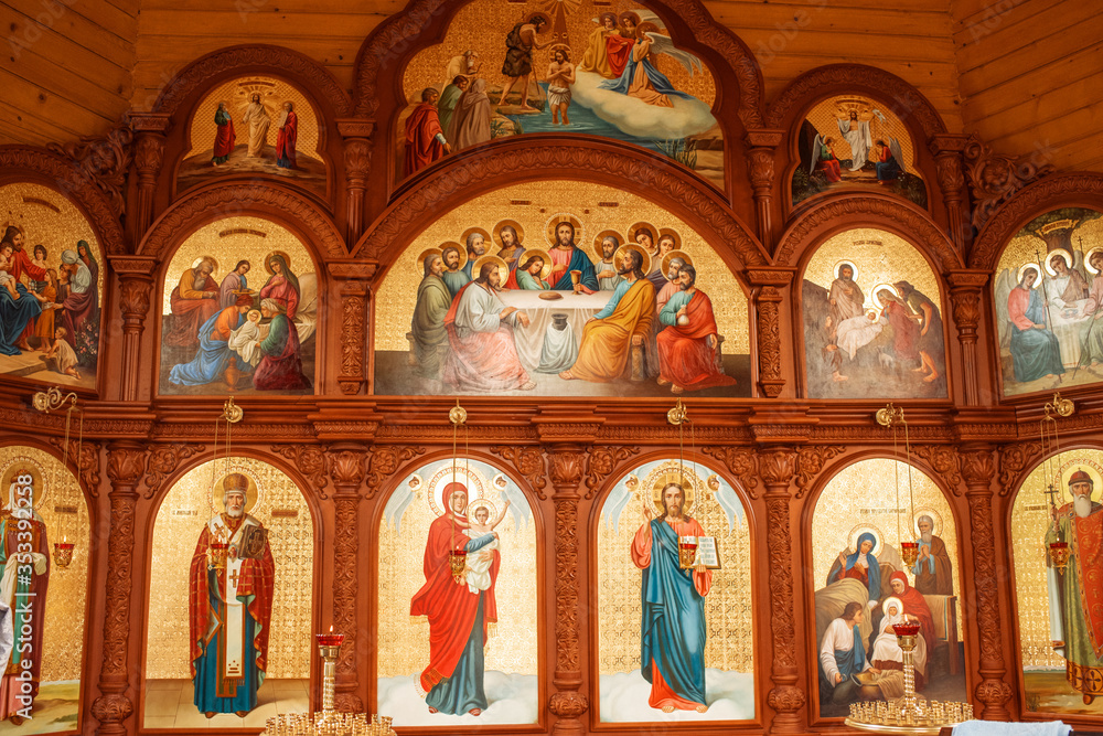 Churches. The baptism of a child. Rite of baptism. Icons in the temple.