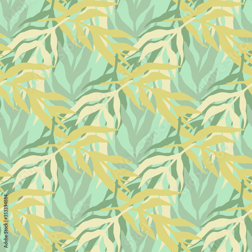 Jungle plants silhouette leaves seamless pattern in green colors. Trendy tropical leaf wallpaper.