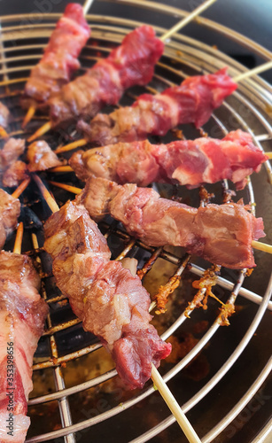  Arrosticini skewers on a grill close up