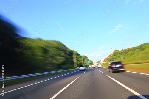 Speeding car on the highway, motion blur