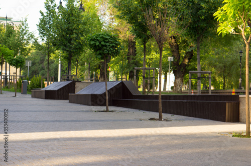 Large wooden bench. A place to relax and socialize while walking around the city. photo