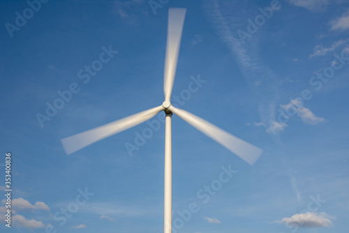 Wind turbine against a blue sky