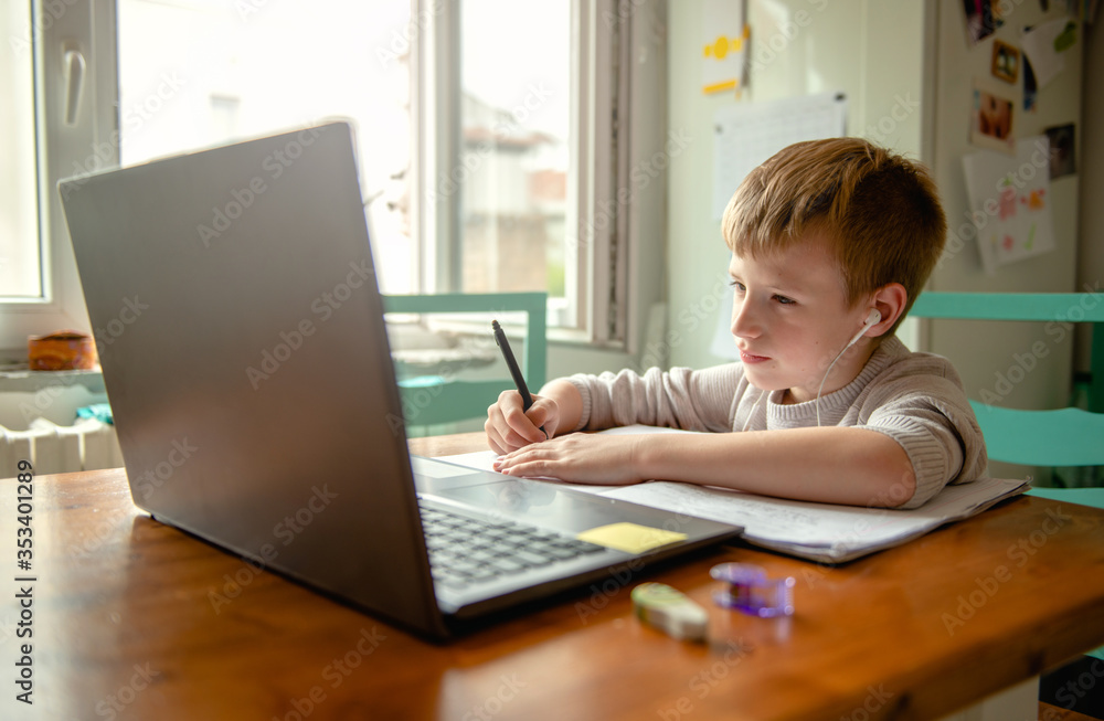 Young boy learning at home during quarantine Young boy learning at home during quarantine