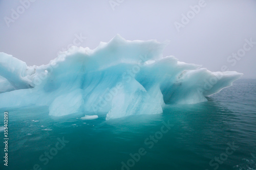 Icebergs floating. Ices and volcanic ash. Glacier lagoon. Melting ice. South coast Iceland.Volcanic ash on the arctic ice. Ice age glacier crevasse melting fast. Global warming. The edge of a glacier © Epic Vision