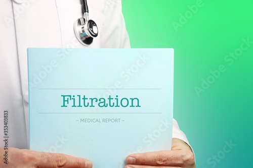 Filtration. Doctor holds documents in his hands. Text is on the paper/medical report. Green background. photo