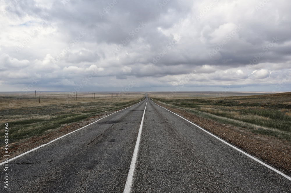 an auto trip through the steppes of Kalmykia during a thunderstorm