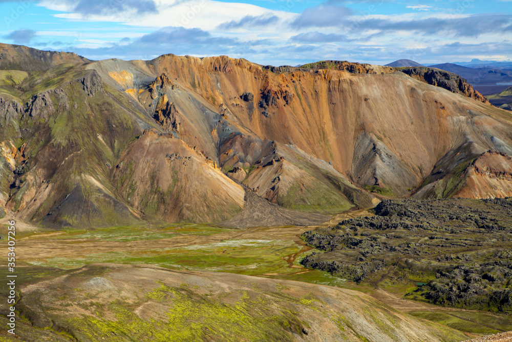 Landscape in Iceland. Green moss over the  volcanic mountains and lava fields in Landmannalaugar national park. Beautiful colored mountains and lava fields.Surreal nature scenery in highland.