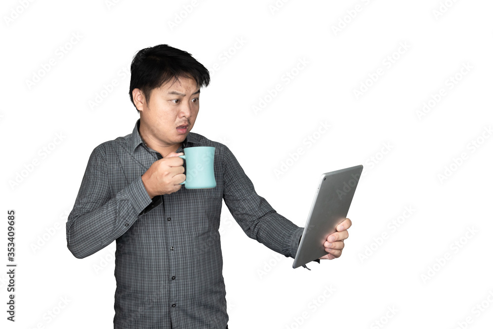 A handsome male Asian office worker standing with a glass of water Blue and the tablet looked at the tablet showing the emotion of people shocked, excited isolated on a white background A handsome male Asian office worker standing with a glass of water Blue and the tablet looked at the tablet showing the emotion of people shocked, excited isolated on a white background
