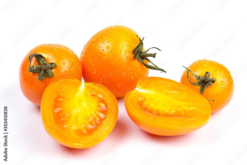 Yellow fresh tomatoes isolated on white background in close-up Yellow fresh tomatoes isolated on white background in close-up
