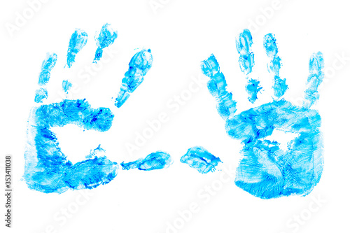 multicolored prints of children's hands and feet on white background. Abstract painted background. Children's art and painting.