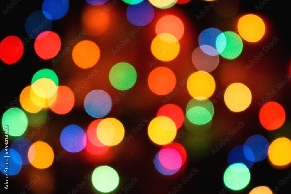 Bokeh effect on Christmas lights with colorful perfect circles Bokeh effect on Christmas lights with colorful perfect circles