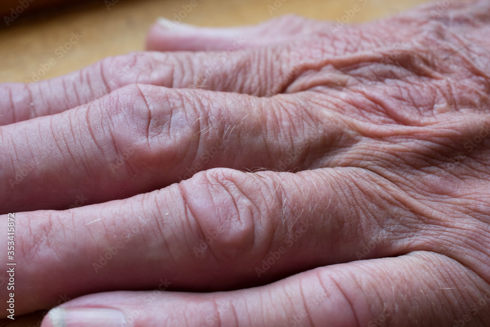 Fototapeta premium Macro image of wrinkles on an old mans hand