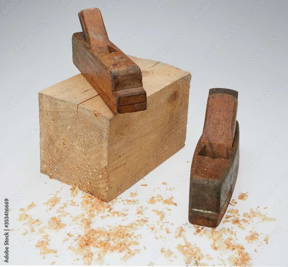 wooden cube with woodworking tools on a white background wooden cube with woodworking tools on a white background