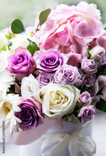 Beautiful flowers in a white round box