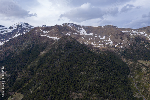 Aerial drone view of mountains in Andorra with snow on top