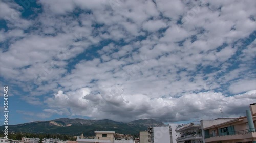 Time lapse: white stratus, cumulus and altostratus cloud formations towards Panachaikon mountain, Peloponnese, Greece photo