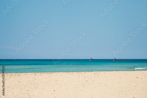 Fototapeta Naklejka Na Ścianę i Meble -  View on Mondello beach with windserf in the distance in Palermo in Sicily