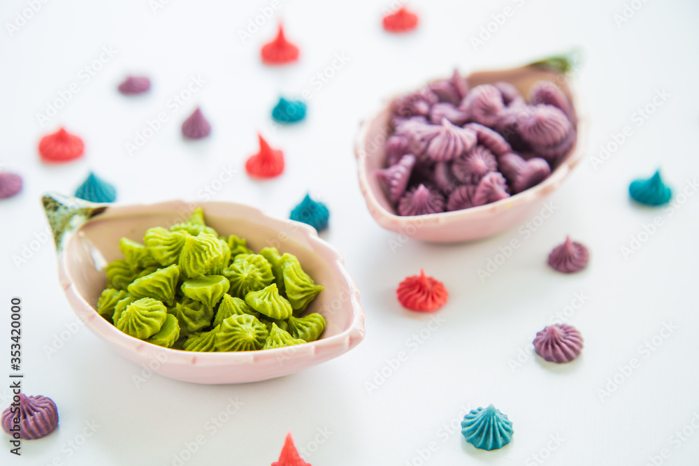 Close up A-lua or Allure Thai handmade candy in mini bowl on white destop. A-lua or Allure is traditional Thai desserts sweet. Close up A-lua or Allure Thai handmade candy in mini bowl on white destop. A-lua or Allure is traditional Thai desserts sweet.