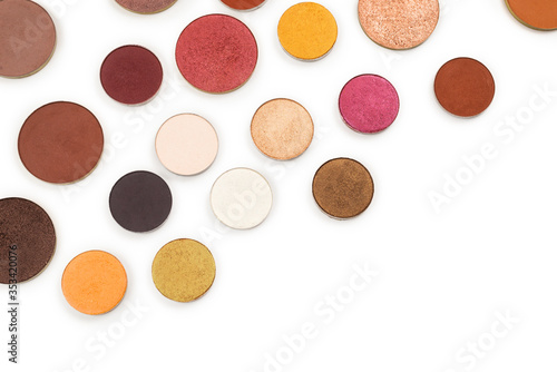 Round multicolored make up eyeshadows isolated on white.