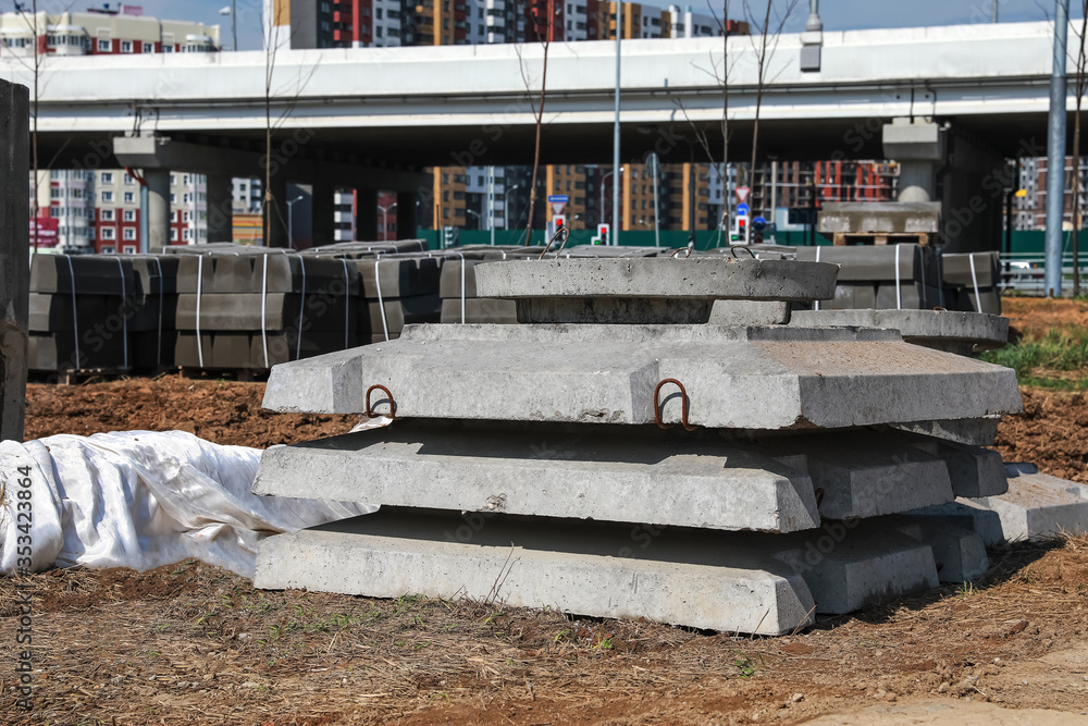 Concrete Piling Rings Construction. Pile of concrete slabs and rings in anticipation of ...