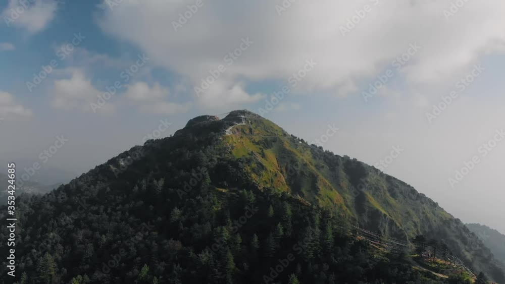4K Aerial View of a Himalayan Hilltop Surrounded by Greenery and Blue Sky. Cinematic Drone Shot of a Hilly Place called George Everest in Mussoorie, Uttarakhand, India. 4K Aerial View of a Himalayan Hilltop Surrounded by Greenery and Blue Sky. Cinematic Drone Shot of a Hilly Place called George Everest in Mussoorie, Uttarakhand, India.