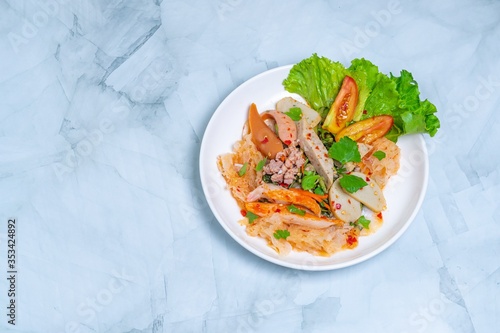 yam wun sen, Glass noodle spicy salad with Thai pork sausage ,mix vegetables,mushrooms, carrots,onions,minced pork and chilly in Thailand it call “Yam moo yo” Popular and famous food in Thai.