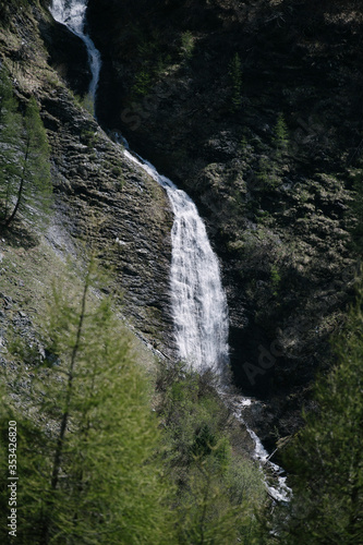 Waterfall in the alpine mountains.