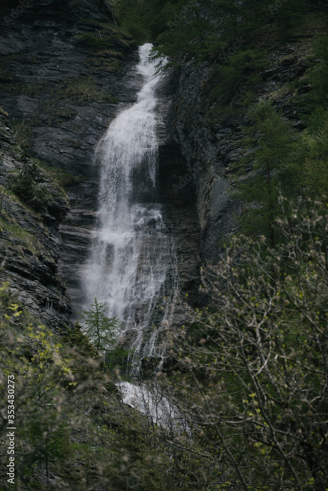 Waterfall in the alpine mountains.