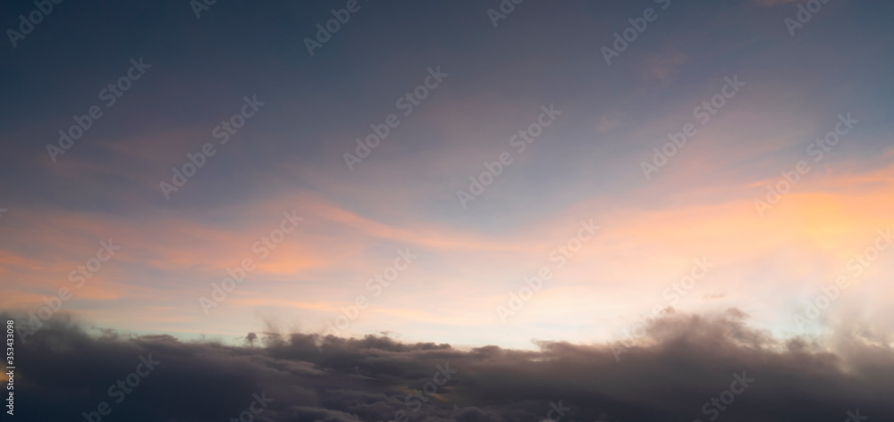 The sunset From above with sky fluffy and soft clouds bright and clear sky use for background and wallpaper