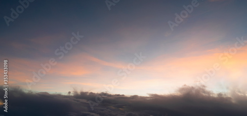 The sunset From above with sky fluffy and soft clouds bright and clear sky use for background and wallpaper © nuttapon