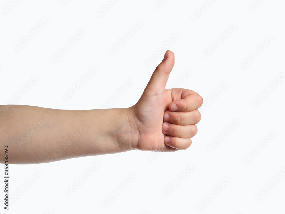 Kid hand show thumbs up sign. Like symbol