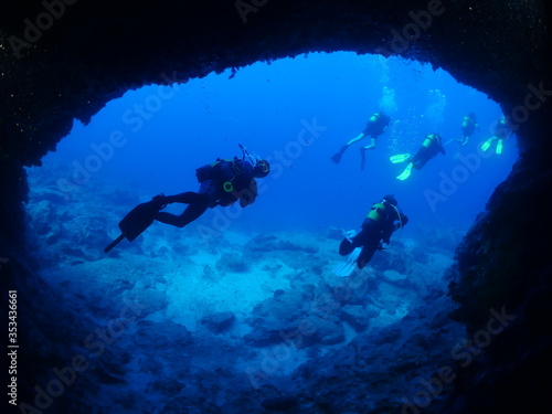 scuba diver cave dive underwater exploring blue caves ocean scenery
