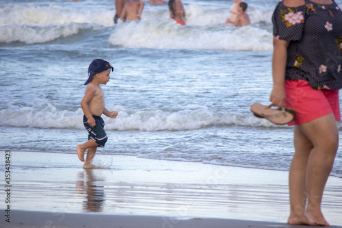 young couple walking on the beach