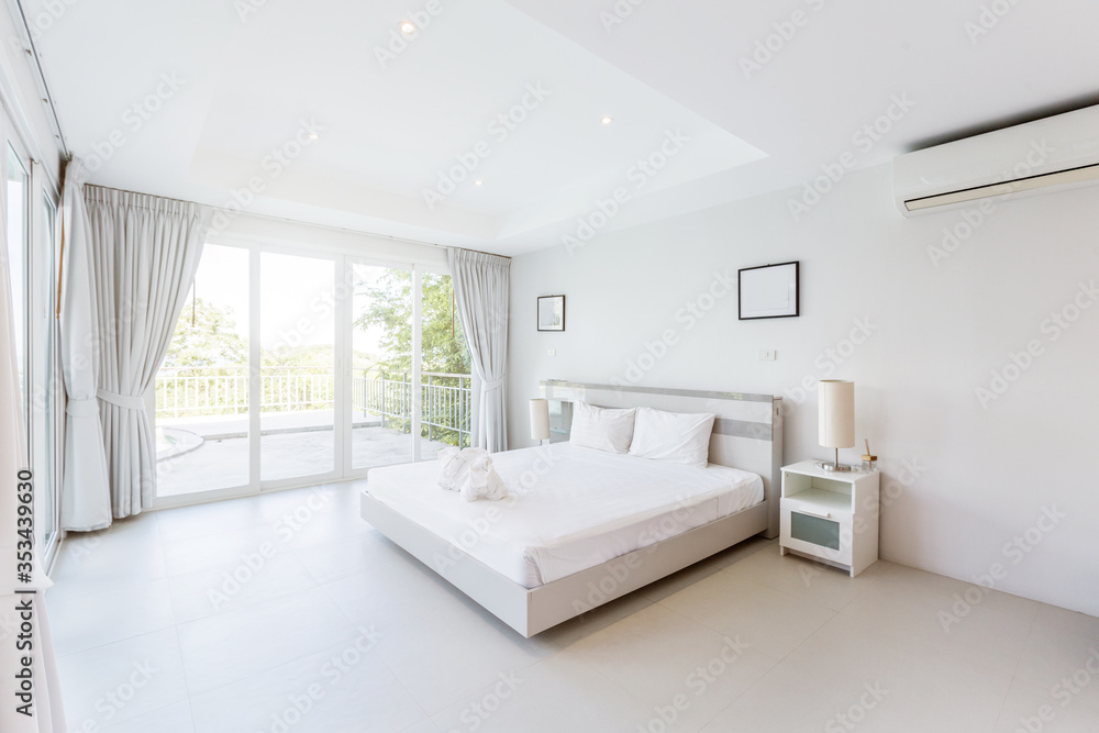 Fototapeta premium Modern bed room interior in Luxury villa. White colours, big window