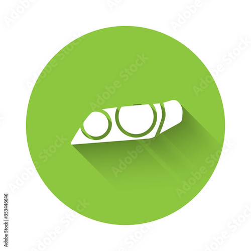 White Car headlight icon isolated with long shadow. Green circle button. Vector Illustration.
