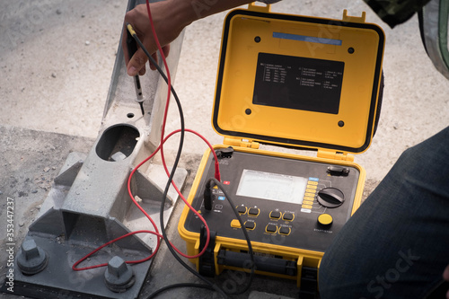 Engineer inspection on railway power supply equipment with electrical measurement tools
