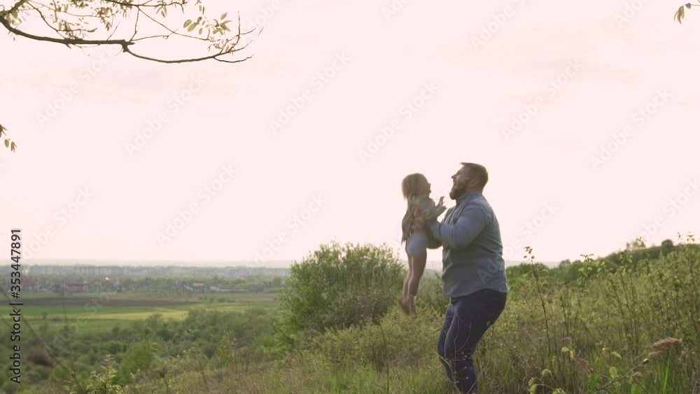 happy, father on the mountain throws his child up happy, father on the mountain throws his child up
