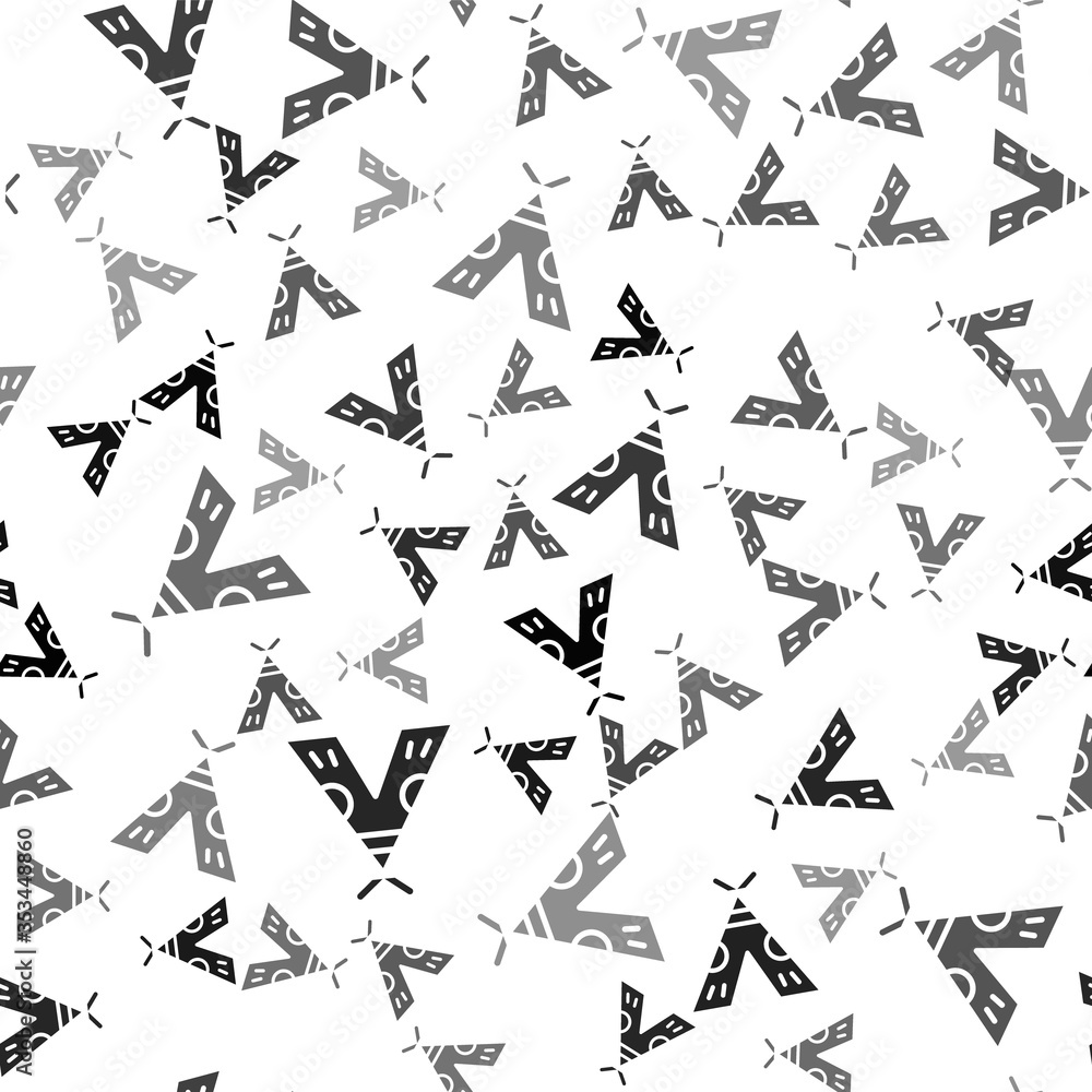 Naklejka premium Black Traditional indian teepee or wigwam icon isolated seamless pattern on white background. Indian tent. Vector Illustration.