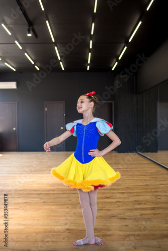 
Girl dancing the dance of snow white. Dance number. Acrobatic stunts. Sports kids. Beautiful girl in a suit of Snow White. Dance is life